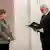 Angela Merkel frente al presidente Frank-Walter Steinmeier.