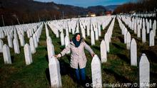 22.11.2017 TOPSHOT - A woman mourns over a relative's grave at the memorial centre of Potocari near Srebrenica on November 22, 2017.
United Nations judges on November 22, 2017 sentenced former Bosnian Serbian commander Ratko Mladic to life imprisonment after finding him guilty of genocide and war crimes in the brutal Balkans conflicts over two decades ago. / AFP PHOTO / Dimitar DILKOFF (Photo credit should read DIMITAR DILKOFF/AFP/Getty Images)
