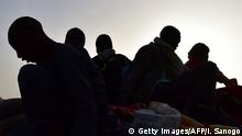 A picture taken on March 31, 2017 shows West African migrants returning from Niger after fleeing Libya due to armed groups by pickup truck in Agadez, northern Niger, following their failed attempt to reach Europe by crossing the Mediterranean Sea. Many migrants from sub-Saharan Africa are driven through southern Libya in trucks to the northern coast where they later attempt the perilous Mediterranean crossing to Italy in Europe some 300 kilometres (180 miles) away. People traffickers have exploited the chaos in Libya since the 2011 uprising deposed and killed strongman Moamer Kadhafi to boost their lucrative but deadly trade.
/ AFP PHOTO / ISSOUF SANOGO (Photo credit should read ISSOUF SANOGO/AFP/Getty Images)