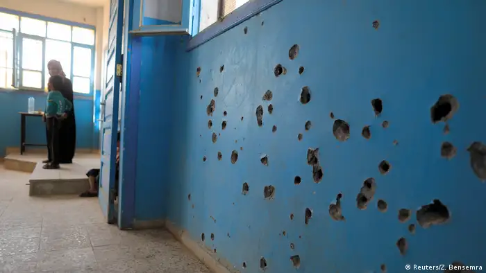 Bullet holes in a wall of a school in Syria (Reuters/Z. Bensemra)a