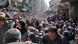 Residents wait in line to receive food aid distributed in the Yarmouk refugee camp on January 31, 2014 in Damascus, Syria Residents wait in line to receive food aid distributed in the Yarmouk refugee camp on January 31, 2014 in Damascus, Syria