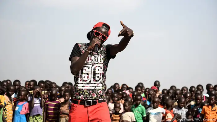 Art to enhance social cohesion: Angel G, a South Sudanese refugee singer, performs during Bidibidis Got Talent auditions at a refugee settlement in Northern Uganda.