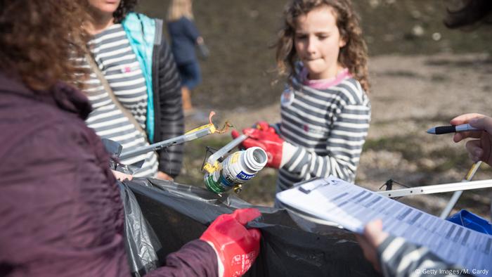 Volunteers help to clean up plastic on a UK beach