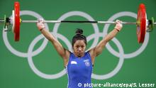 06.08.2016
epa05460251 Chanu Saikhom Mirabai of India during her attempt over 85kg during the women's 48kg category group A competition of the Rio 2016 Olympic Games Weightlifting events at the Riocentro in Rio de Janeiro, Brazil, 06 August 2016. EPA/ERIK S.LESSER +++(c) dpa - Bildfunk+++ |