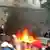 Protestors in Moldova burn furniture outside of parliament
