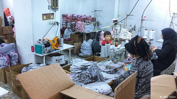 Children working at sewing machines