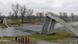 A helicopter flies over the place where a footbridge crashed in Prague, Czech Republic A helicopter flies over the place where a footbridge crashed in Prague, Czech Republic