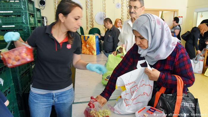 Refugee woman at a food bank