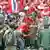 مظاهره کنندگان که پیراهنهای سرخ دارند، با پلیس تایلند نیز زدو خوردهایی داشته اند