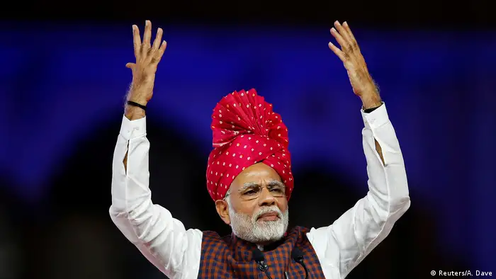 Indian Prime Minister Narendra Modi gesturing on stage