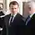 French President Emmanuel Macron (L) welcomes Israeli Prime Minister Benjamin Netanyahu