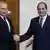 Russian President Vladmir Putin shakes hands with Egyptian President Abdel Fattah el-Sisi