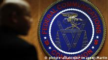 The seal of the Federal Communications Commission (FCC) is seen before an FCC meeting to vote on net neutrality in Washington, Thursday, Dec. 14, 2017. (AP Photo/Jacquelyn Martin) |