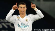 Real Madrid's attacker Cristiano Ronaldo gestures to his teammates during the Club World Cup UAE 2017 final football match between Gremio FBPA and Real Madrid at the Zayed Sports City Stadium in Abu Dhabi on December 16, 2017. / AFP PHOTO / KARIM SAHIB (Photo credit should read KARIM SAHIB/AFP/Getty Images)