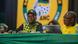 Jacob Zuma and Cyril Ramaphosa sit on a podium with an ANC banner in the background Jacob Zuma and Cyril Ramaphosa sit on a podium with an ANC banner in the background