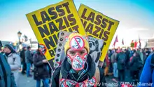 18.12.2017 *** A protester stands with stickers depicting crossed out incoming vice-chancellor of the far-right Freedom Party (FPOe) Christian Strache and incoming Austrian Chancellor of the conservative People's Party (OeVP) Sebastian Kurz during a protest near the presidential palace during the inauguration of the new Austrian government in Vienna, Austria, on December 18, 2017.
Austria's far-right Freedom Party is set to round off a triumphant year for Europe's nationalists by being sworn in as part of the Alpine country's new government. / AFP PHOTO / JOE KLAMAR (Photo credit should read JOE KLAMAR/AFP/Getty Images)