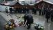 A person places a candle in front flowers at a memorial at the Breitscheidplatz Christmas market A person places a candle in front flowers at a memorial at the Breitscheidplatz Christmas market