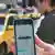 An Uber app is seen on a person's phone in New York City