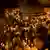 Orthodox Christian pilgrims hold candles during the procession of the Holy Fire.