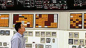 TO GO WITH ENERGIA NUCLEAR ** FILE ** A worker checks the control panel of the No.1 unit of Qinshan No. 2 Nuclear Power Plant, China's first self-designed and self-built national commercial nuclear power plant in this June 10, 2005 file photo in Qinshan, about 125 kilometers (about 90 miles) southwest of Shanghai, China. Global warming and rocketing oil prices are making nuclear power fashionable, drawing a once demonized industry out of the shadows of the Chernobyl disaster as a potential shining knight of clean energy. (AP Photo/Eugene Hoshiko, file)