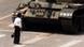 A Chinese protestor blocks a line of tanks heading east on Beijing's Cangan Blvd. June 5, 1989 in front of the Beijing Hotel. The man, calling for an end to the violence and bloodshed against pro-democracy demonstrators, was pulled away by bystanders, and the tanks continued on their way. (AP Photo/Jeff Widener) A Chinese protestor blocks a line of tanks heading east on Beijing's Cangan Blvd. June 5, 1989 in front of the Beijing Hotel. The man, calling for an end to the violence and bloodshed against pro-democracy demonstrators, was pulled away by bystanders, and the tanks continued on their way. (AP Photo/Jeff Widener)