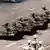 A Chinese protestor blocks a line of tanks heading east on Beijing's Cangan Blvd. June 5, 1989 in front of the Beijing Hotel. The man, calling for an end to the violence and bloodshed against pro-democracy demonstrators, was pulled away by bystanders, and the tanks continued on their way.