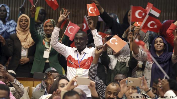Sudanese students waving Turkish flags.