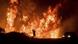A motorist watches flames from the Thomas fire leap above the roadway north of Ventura, Calif. A motorist watches flames from the Thomas fire leap above the roadway north of Ventura, Calif.