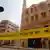 Police tape cordon is seen at the site of an attack on a church in the Helwan district