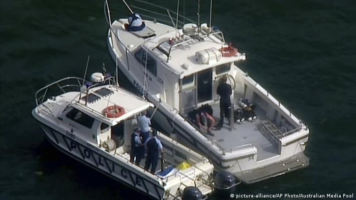 Rescue teams on boats in the Hawksbury River north of Sydney.