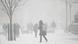 People walk in New York City as a massive winter storm called a "bomb cyclone" hits the area People walk in New York City as a massive winter storm called a "bomb cyclone" hits the area