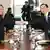 North Korea's Ri Son Gwon and South Korea's Cho Myong Gyon shake hands across a table on January 9
