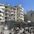 Schwer beschädigte Wohnblöcke in der Stadt Idlib (Foto: picture-alliance)