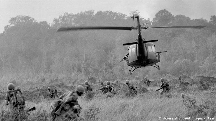  A U.S. helicopter lifts off under sniper fire as troops move to secure a jungle clearing for further landings near Soui Da, 15 miles north of Tay Ninh, Nov. 8, 1966.
