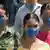 مکزیکی‌ها برای جلوگیری از ابتلا به آنفلوانزای خوکی در فضای عمومی ماسک می‌زنند