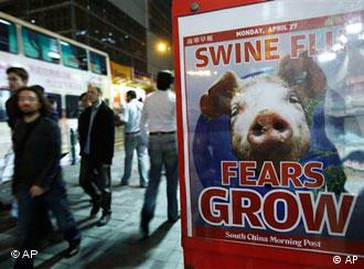 A newspaper headline of swine flu is seen on a downtown street in Hong Kong