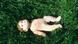 Doll lying in the grass Doll lying in the grass