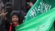 Saudi woman holding up flag in stadium Saudi woman holding up flag in stadium