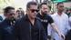 Salman Khan, wearing dark sunglasses, walks through a crowd of photographers. Salman Khan, wearing dark sunglasses, walks through a crowd of photographers.
