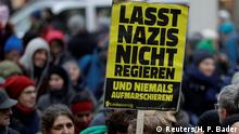 Protestors hold signs during an anti-government demonstration in Vienna, Austria January 13, 2018. Signs read don't let Nazis into government. REUTERS/Heinz-Peter Bader