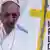 A banner showing the pope and a yellow cross