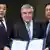 North Korea's and South Korea's sports ministers and the IOC president pose with documents after a signing ceremony
