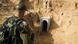 An Israeli soldier looks at a concrete tunnel built by Palestinians in Gaza An Israeli soldier looks at a concrete tunnel built by Palestinians in Gaza