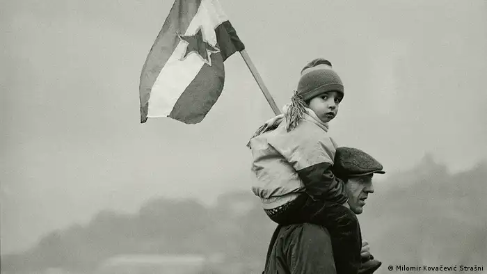 A child holding the Yugoslavian flag – from the Once Upon a Time in Yugoslavia exhibition by Milomir Kovacevic
