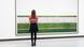 A woman stands in front of the Andreas Gursky photo Rhine II A woman stands in front of the Andreas Gursky photo Rhine II