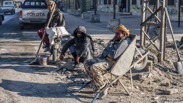 Workers take a break in Raqqa