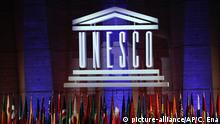 The logo of the United Nations Educational, Scientific and Cultural Organisation (UNESCO) is seen during the 39th session of the General Conference at the UNESCO headquarters in Paris, Saturday, Nov. 4, 2017. (AP Photo/Christophe Ena) |