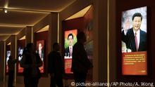 Visitors walk past images of China's past and present leaders, from left, Mao Zedong, Deng Xiaoping, Jiang Zemin, Hu Jintao and Xi Jinping on display at an exhibition on the Long March at the military museum in Beijing, Monday, Oct. 24, 2016. Having punished more than a million Communist Party members for corruption, current President Xi will use a key meeting that started Monday to drive home the message that his signature anti-graft campaign is far from over and that his authority remains undiminished. (AP Photo/Andy Wong) |