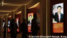 Visitors walk past images of China's past and present leaders, from left, Mao Zedong, Deng Xiaoping, Jiang Zemin, Hu Jintao and Xi Jinping on display at an exhibition on the Long March at the military museum in Beijing, Monday, Oct. 24, 2016. Having punished more than a million Communist Party members for corruption, current President Xi will use a key meeting that started Monday to drive home the message that his signature anti-graft campaign is far from over and that his authority remains undiminished. (AP Photo/Andy Wong) |