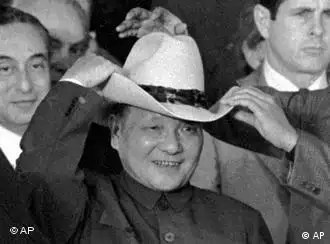 ** FILE ** In this Feb 2, 1979 file photo, then Chinese Vice Premier Deng Xiaoping tries on a cowboy hat presented to him at a rodeo in Simonton, Texas. Forged in absolute secrecy at the height of the Cold War 30 years ago, the diplomatic ties established between the United States and China were meant to balance out the Soviet threat.(AP Photo/File)